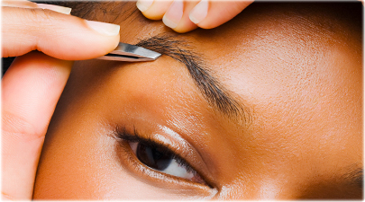 getty_rf_photo_of_woman_plucking_brows1